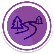 A circular purple badge with a simple road winding between pine trees in the center.